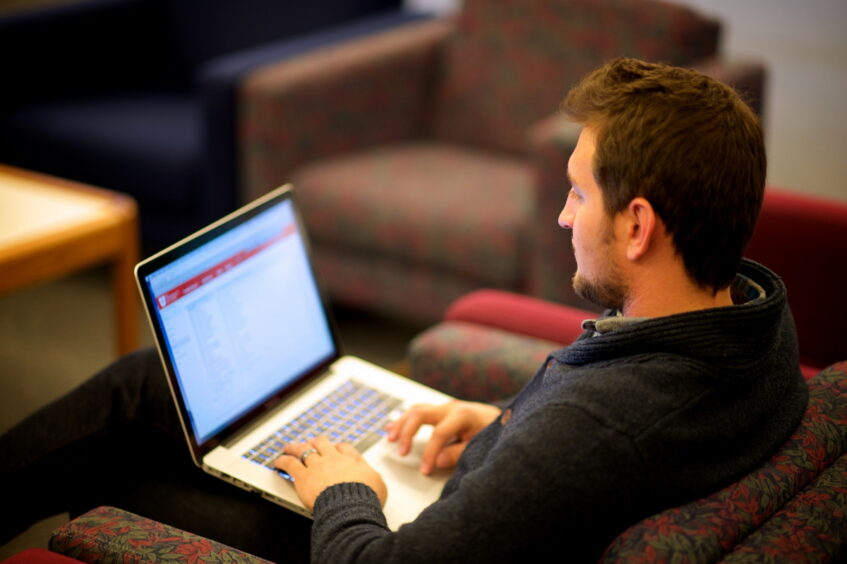 Man on a laptop. Intuitive website navigation.