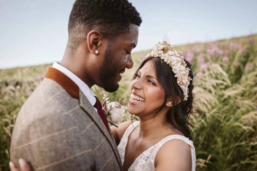 Newly Wed Interracial Couple. Ad for wedding photography