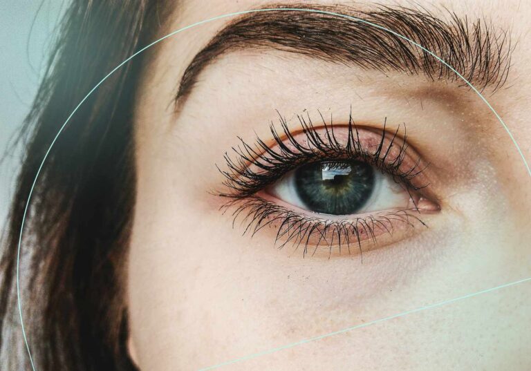 Image of a woman with thick eyelashes. Concept for depiction of benefits for eyelash serum