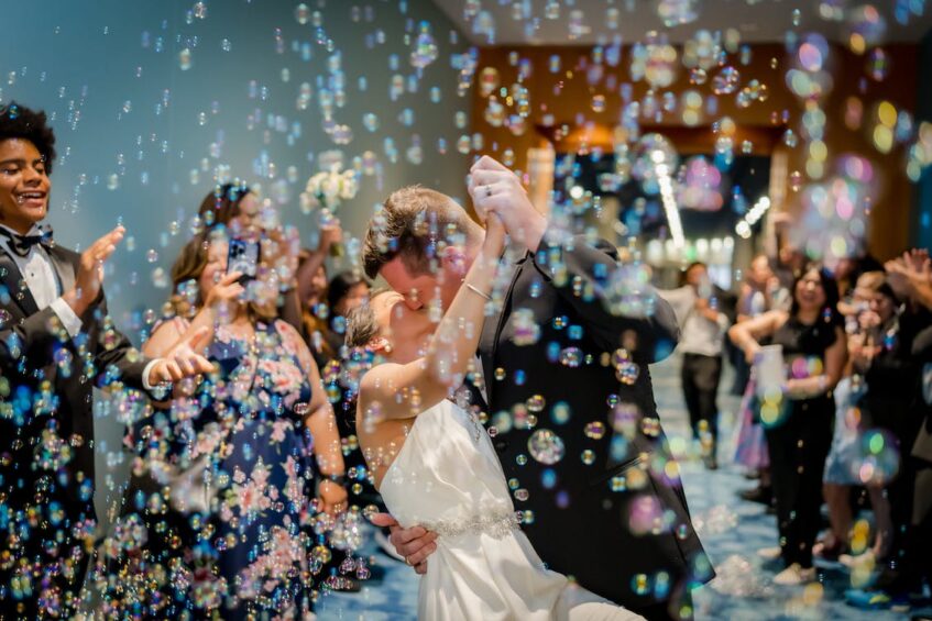 Couple dancing on their wedding day with bubble theme