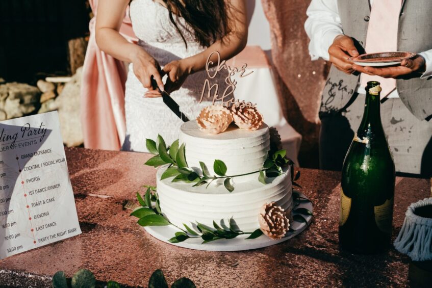 Bride and Groom Cutting a Wedding Cake. Depiction of A Memorable Wedding Experience.