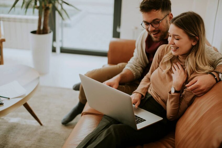 couple planning a wedding on a computer