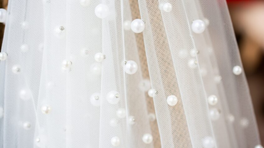 Pearl details decorate sheer bridal tulle